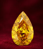 GIA Certified 1.07 CT Pear Diamond Enhanced Orange-Yellow Color (8.35 MM)